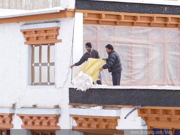 Clearing the snow from the roof