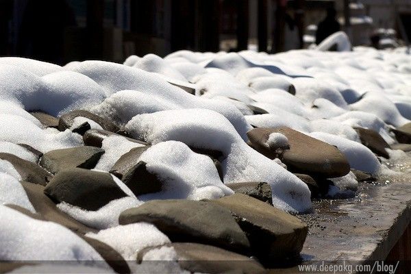 Random snow-covered pebbles