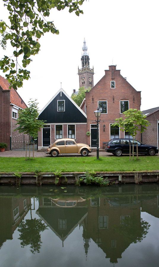 Old houses, cars and canals in Edam