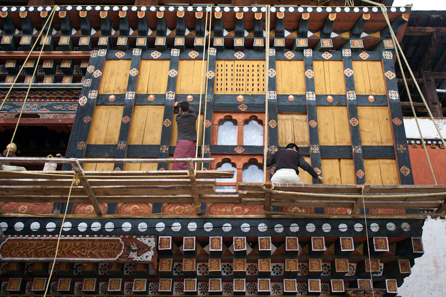 A wall gets a fresh coat of paint at the Paro Dzong