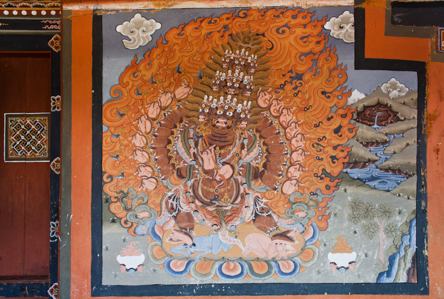 A Buddhist deity with 9 heads and 18 arms